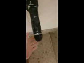 Public shower masturbation with a big dildo in the gym