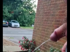 Chubby gay man takes a risky piss outdoors