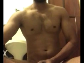 Gay Indian man masturbates and ejaculates on camera.