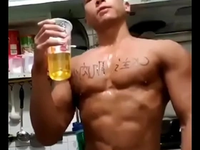 Gay Asian man enjoys pee play