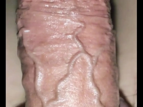Solo boy enjoys a clear dildo alone.
