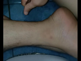 A solo boy gives a sensual massage with oil to himself.