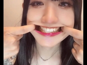 Short video of an Asian ladyboy with a tooth fetish.