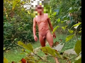 Gay Myanmar man strips and takes a sensual walk in the woods with an anal toy.
