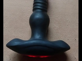 Men having sex with a sex toy shaped like an penis.