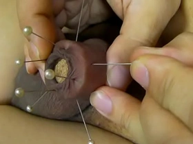 Japanese soloboy enjoys pain and pleasure of a needle in his foreskin
