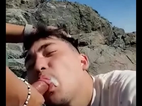 Young Asian girl gives blow job outdoors